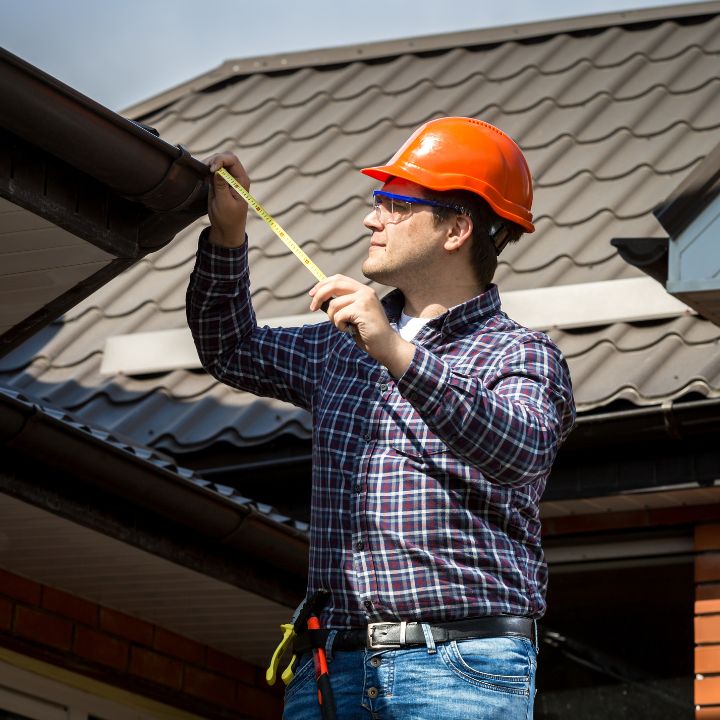 licenced home inspector assessing a roof during a wind mitigation inspection in miami florida